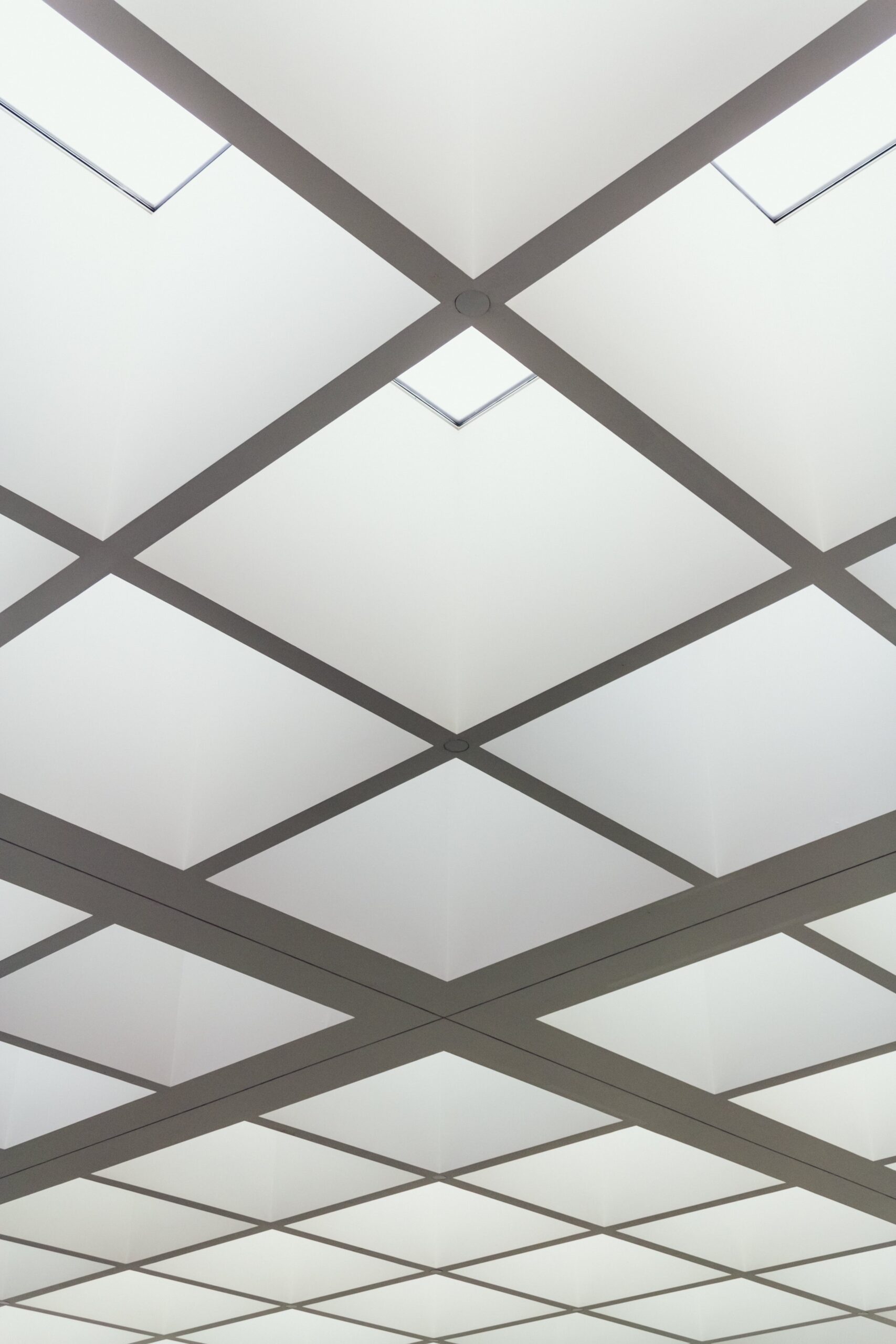 low-angle-shot-ceiling-building-made-bright-lighted-squares-min